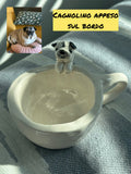 Tazza con animale appeso